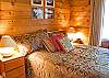 This nice wood paneled room with a Queen Size Bed has a cozy cottage feel.