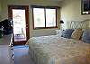 King Bedroom has entrance out to back deck.