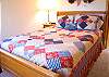 This upstairs guest room features a Queen Size Bed and personal door to the double-bath.