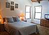 This upstairs Queen Master Bedroom has an attached bathroom.