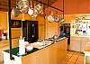 Double oven, large refrigerator, large island and a mini bar.