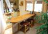 Enjoy visiting and relaxing at your very own bar right off the living room.  Steps down to bar sink, glasses and refrigerator.