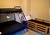 A second kids' room features a pyramid bunk and a twin.  This room is a brand new addition to the home.  There is lots of room for kids to play.