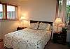 Queen bedroom down the hall from the bunk bedroom.  Bath with shower next door.  Bath also has door to small deck.