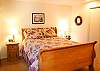 The first bedroom upstairs features a Queen Bed. It shares a hall bathroom.