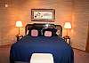 This King bedroom has a TV, DVD and bathroom with a shower, and door to outside deck with hot tub, located off of the living room area.