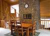 The dining room is on the level above the living room. It has a wonderful fireplace which will make any meal special.