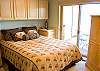 Downstairs queen bedroom with door to private deck.