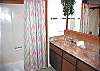 This home has two bathrooms, one master bathroom and one hall bathroom.
