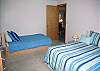Double bed with twin trundle bed.  This bedroom is off the living room and shares a hall bath.