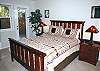 Queen bedroom downstairs with door to hot tub and deck.  This master has a TV/DVD as well.  Master bath has shower.