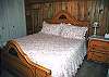 This upstairs bedroom features a King Size Bed.  The two upstairs bedrooms share a hall bathroom.