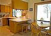 Great open kitchen and breakfast nook. Start the day right with a cup of coffee and a great view out the window.