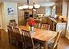Beautiful hard wood dining table that seats 8 with additional seating at the kitchen counter.