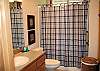 Upstairs shower/bath is in main hall and shared by twin room and queen bedroom. Queen room has its own entrance into the bath.