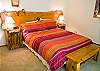 Cozy and warm Queen Master Bedroom with tub and shower, Flat Screen TV, VHS and DVD.