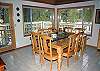 Nice large dining room table, seats 8 with room in the middle for those special dishes. Door to the deck which has table, chairs and lounge chairs for those wonderfully warm days.