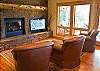 Upstairs you will find a spacious sitting area with a large screen TV and and a gas fireplace to cozy up by.