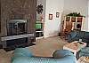 Spacious living room with lots of windows. Light and bright. Enjoy a relaxing vacation with family and friends.