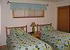 Cute Twin Bedroom shares a bathroom with the Queen Bedroom.