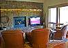 Upstairs you will find another spacious sitting area that has a large screen TV and another gas fireplace to cozy up by.