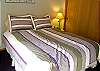 This is the second bedroom that is upstairs and has a Queen Bed.  The two upstairs bedrooms share a full bathroom.  This bedroom has a TV.