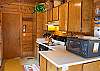 This clean and well organized kitchen makes meal preparation easy.
