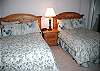 Two Full Beds with TV/DVD.  Has walk through bath, tub/shower with other bedroom.