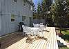 Move your party to the outside with these two tables and chairs and BBQ.