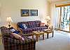 Living room that opens up to the dining room. Has a wood fireplace. Lots of room, nice and cozy. Great for any family.