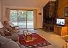 Comfortable living and dining area, plenty of seating for everyone.  This unit is across the street from the Association pool and tennis courts. 