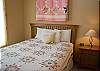 This Queen Bedroom has tall windows which makes it light and bright.  This bedroom shares a hall bathroom with  tub/shower.