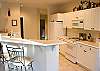 A completely equipped kitchen is ready for easy preparation of family meals.  The kitchen is open to the living room and dining room so the chef is never left out of the fun.