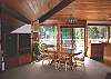 Warm wood ceiling and large windows bring the outside in.