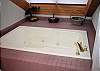 Jacuzzi tub and overhead sky light in the Master King Bedroom upstairs.