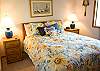 This Queen Size Bedroom shares a hall bathroom.