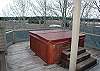 Enjoy the view from your hot tub which is located outside the dininig room, on the wrap around deck and can be accessed from many rooms in the home.