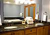 Everyone will have room in this bathroom to get ready for a night on the town.  Dual vanity sinks, granite counter tops and a large jetted tub.