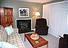 Warm and inviting den with gas
fireplace.
