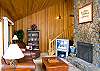 Living Room features a wood burning fireplace.
