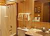 This hall bathroom has a shower/tub combination.