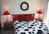 Bright, cheerful Master King Bedroom downstairs.