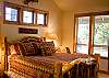 King Master Bedroom has a comfy and cozy fireplace along with a TV.