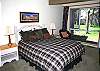 The other Queen Bedroom downtstairs has big windows!