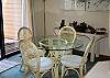 Enjoy your meals at this cozy table and wander out onto the deck for an enjoyable relaxing time.