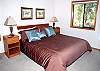 Relax in this master king bedroom with TV, DVD.  This bedroom is off the dining room.