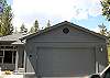 2 Car Garage with ski racks on back wall.