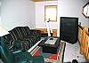 Loft with big screen and treadmill.