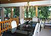 Dining room steps down to living room and out to the deck.