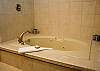 Relaxing jacuzzi tub awaits in the upstairs Master King Bathroom.